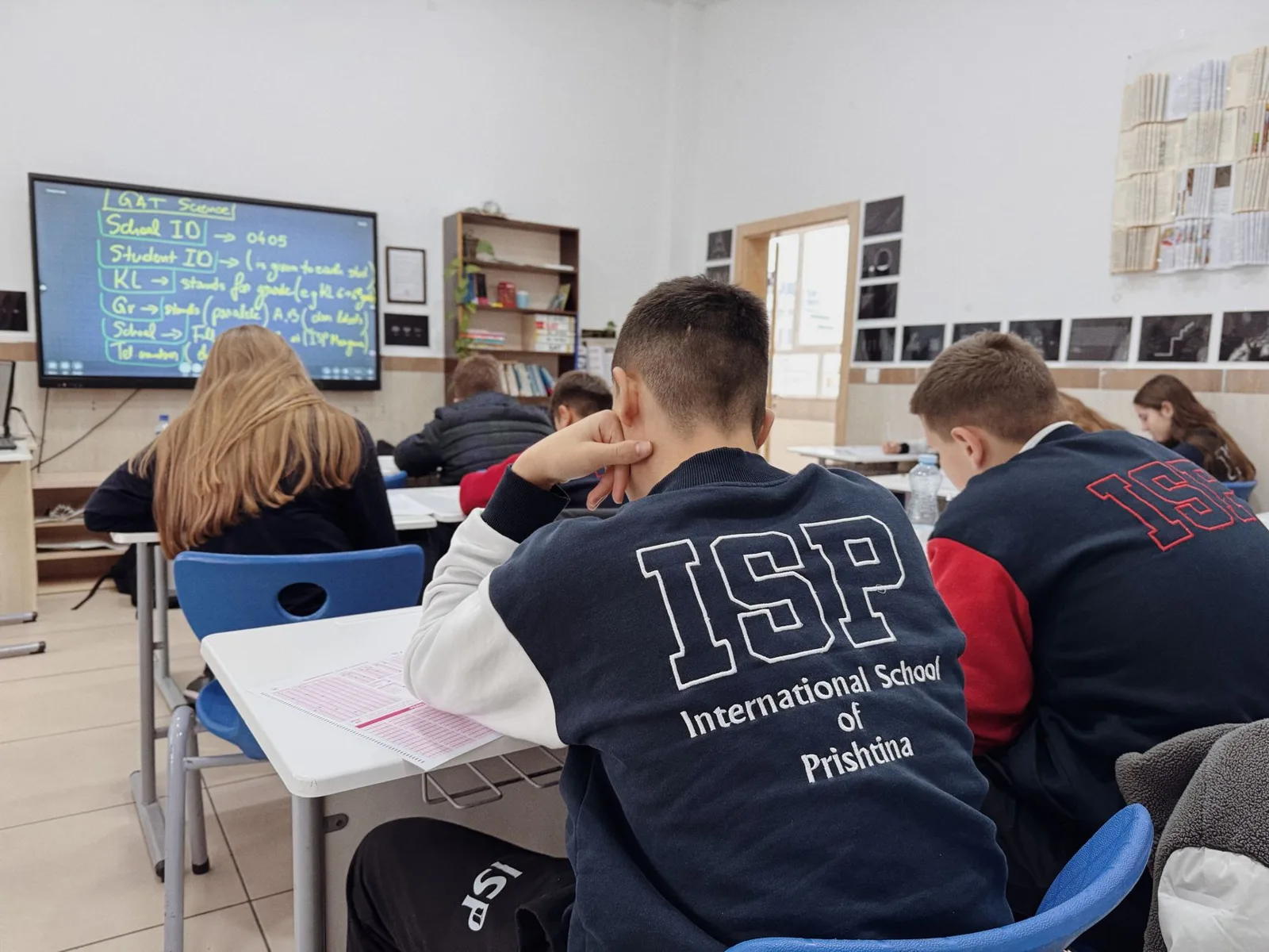 Students at desks in a school classroom