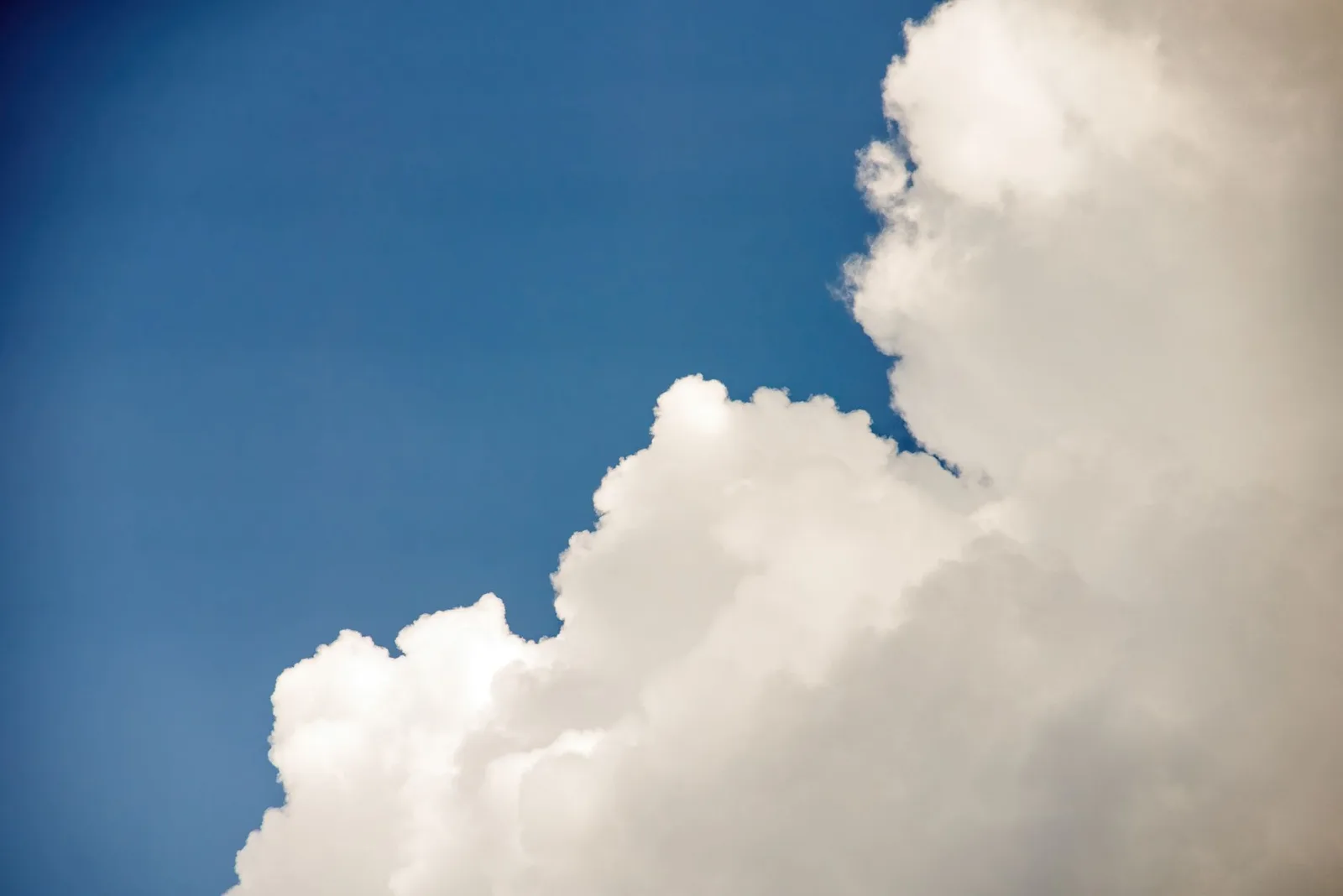 Blue sky with white clouds seen from above